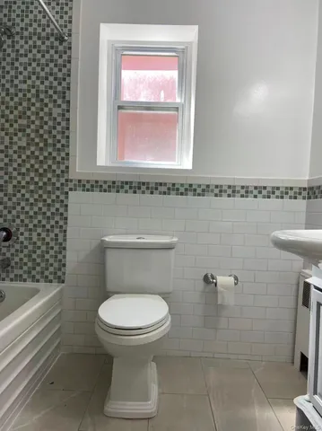 a bathroom with a toilet a sink and a bathtub