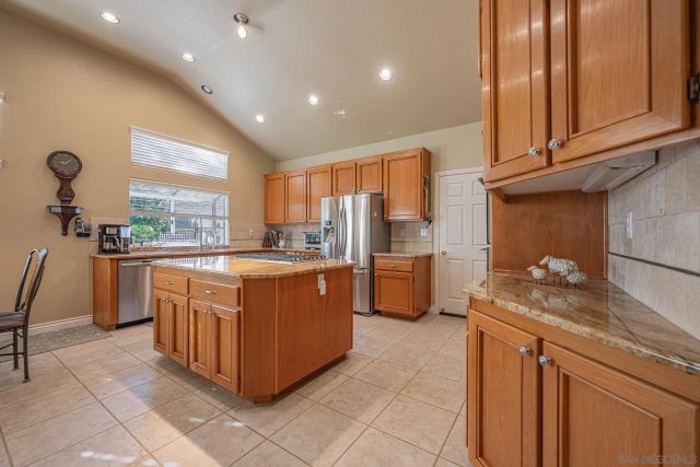 a stove top oven sitting inside of a kitchen