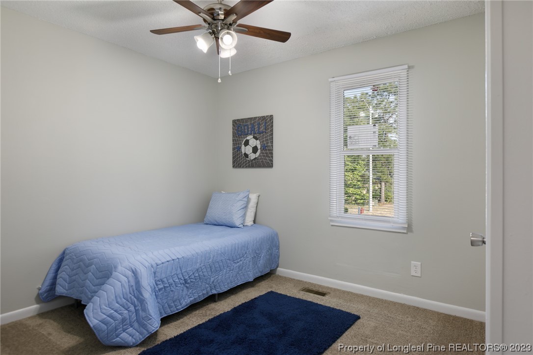 4514 Ruby Road Fayetteville, NC 28311 - Photo 15 of 21 a bedroom with a bed and a window
