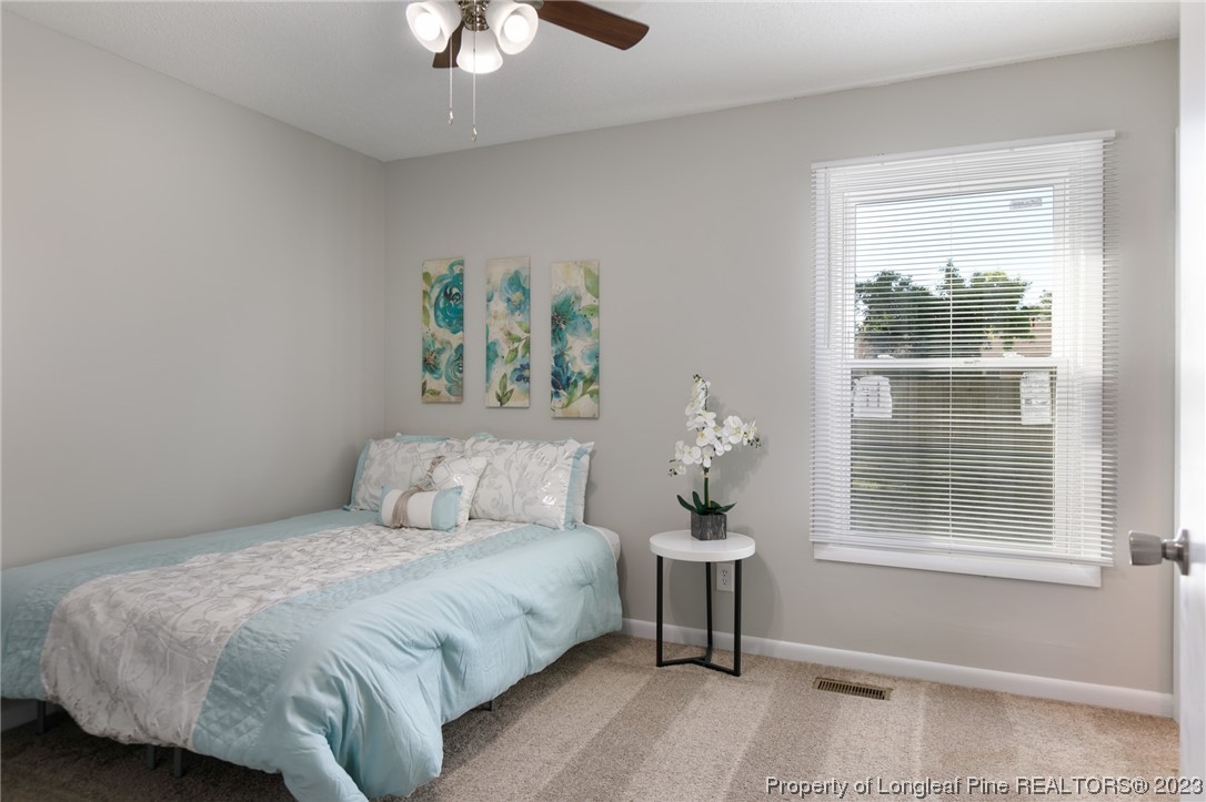 4514 Ruby Road Fayetteville, NC 28311 - Photo 17 of 21 a bedroom with a bed and a window