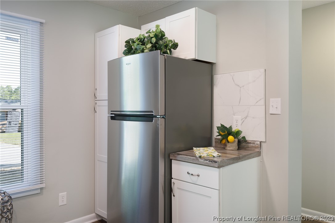 4514 Ruby Road Fayetteville, NC 28311 - Photo 9 of 21 a white refrigerator freezer sitting in a kitchen