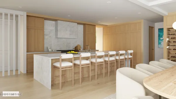 a kitchen with a table chairs and window