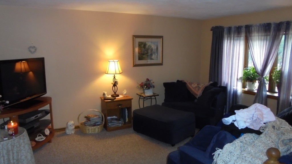 108 Wyman Road Billerica, MA 01821 - Photo 8 of 21 a living room with furniture and a flat screen tv