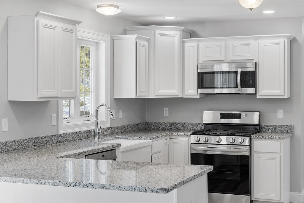 156 French Road, Unit LOT 5 Templeton, MA 01468 - Photo 12 of 39 a kitchen with stainless steel appliances granite countertop a sink stove and microwave