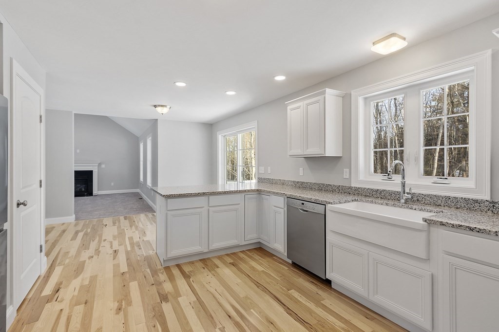 156 French Road, Unit LOT 5 Templeton, MA 01468 - Photo 14 of 39 a kitchen with granite countertop cabinets stainless steel appliances a sink and a window