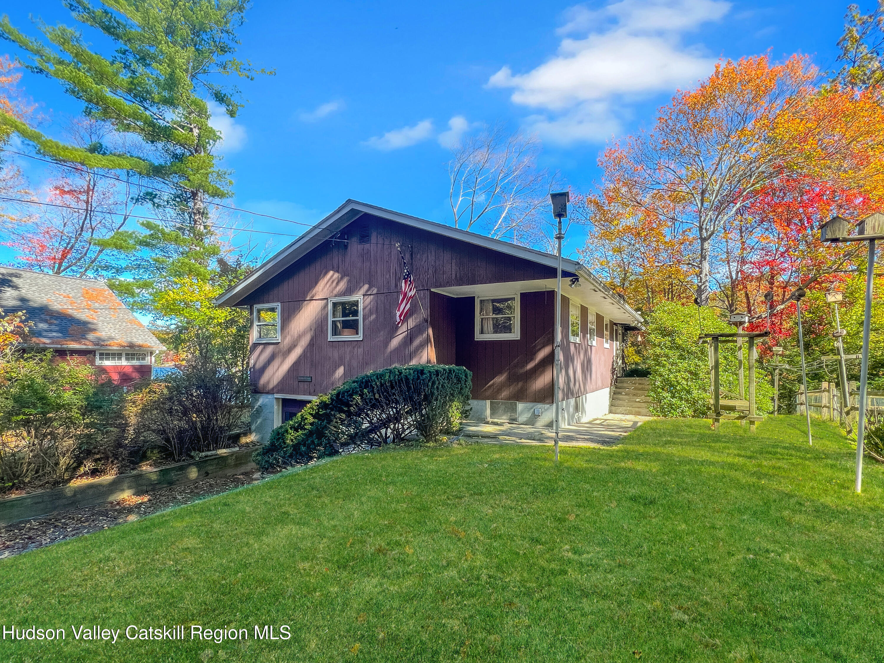1076 Lakeview Road Copake, NY 12516 - Photo 1 of 19 a front view of a house with garden