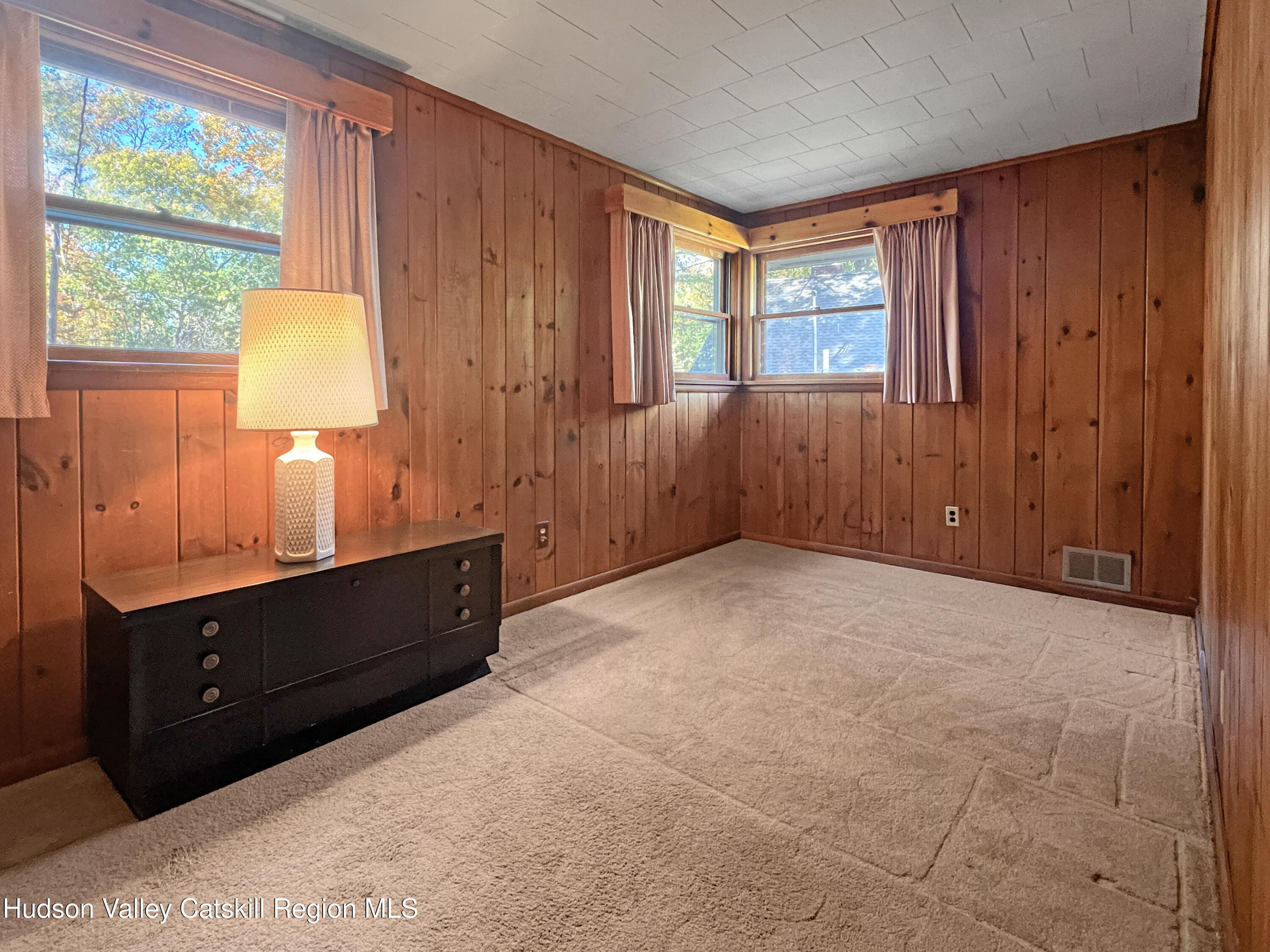 1076 Lakeview Road Copake, NY 12516 - Photo 12 of 19 a room with window and lamp