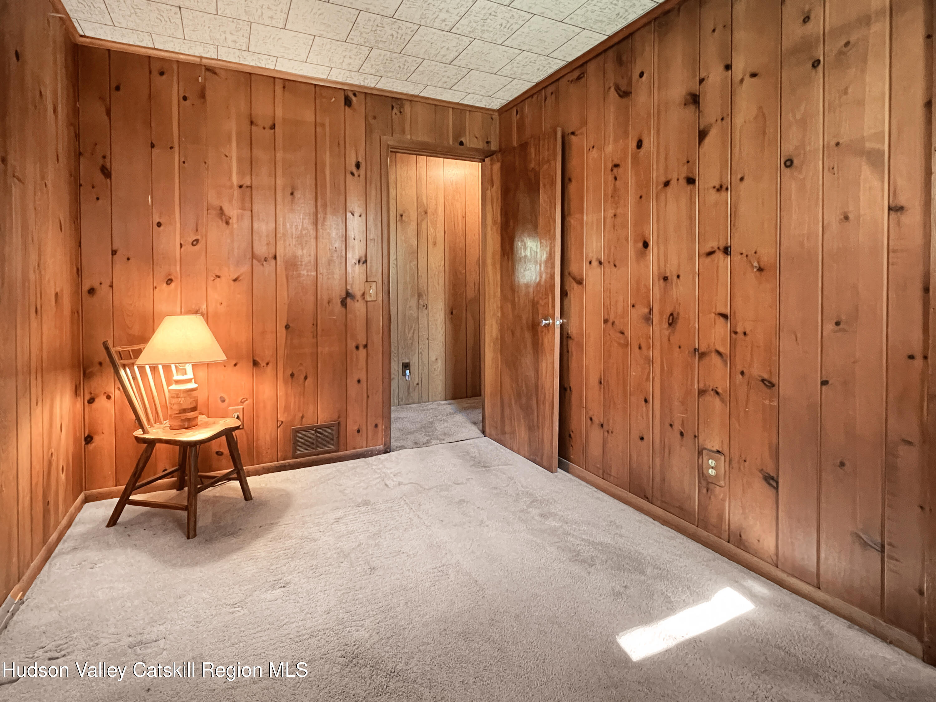 1076 Lakeview Road Copake, NY 12516 - Photo 13 of 19 a view of a room with a chair and door