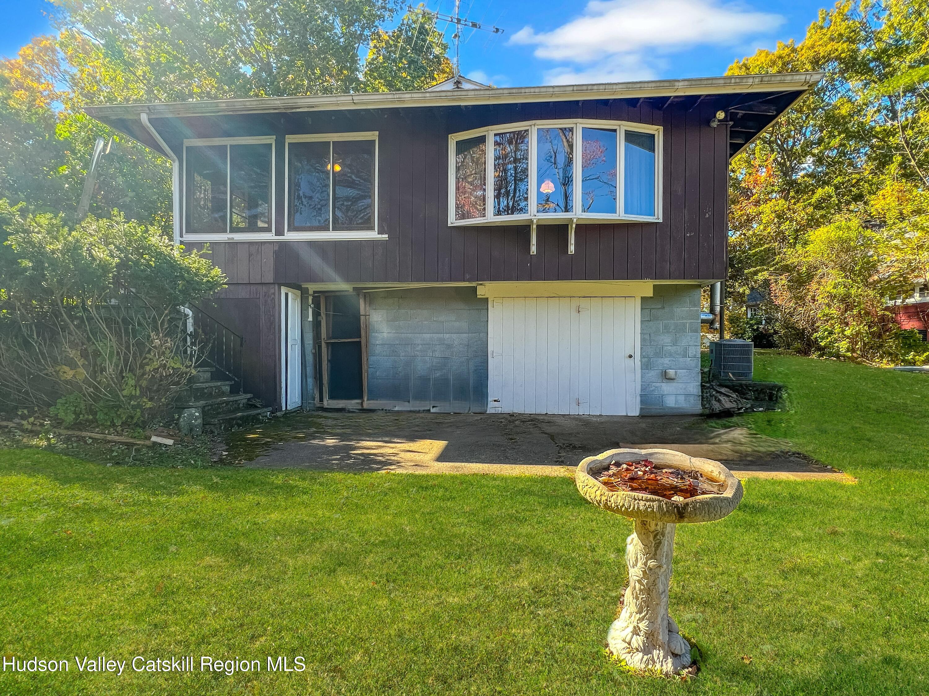 1076 Lakeview Road Copake, NY 12516 - Photo 17 of 19 a backyard of a house with table and chairs
