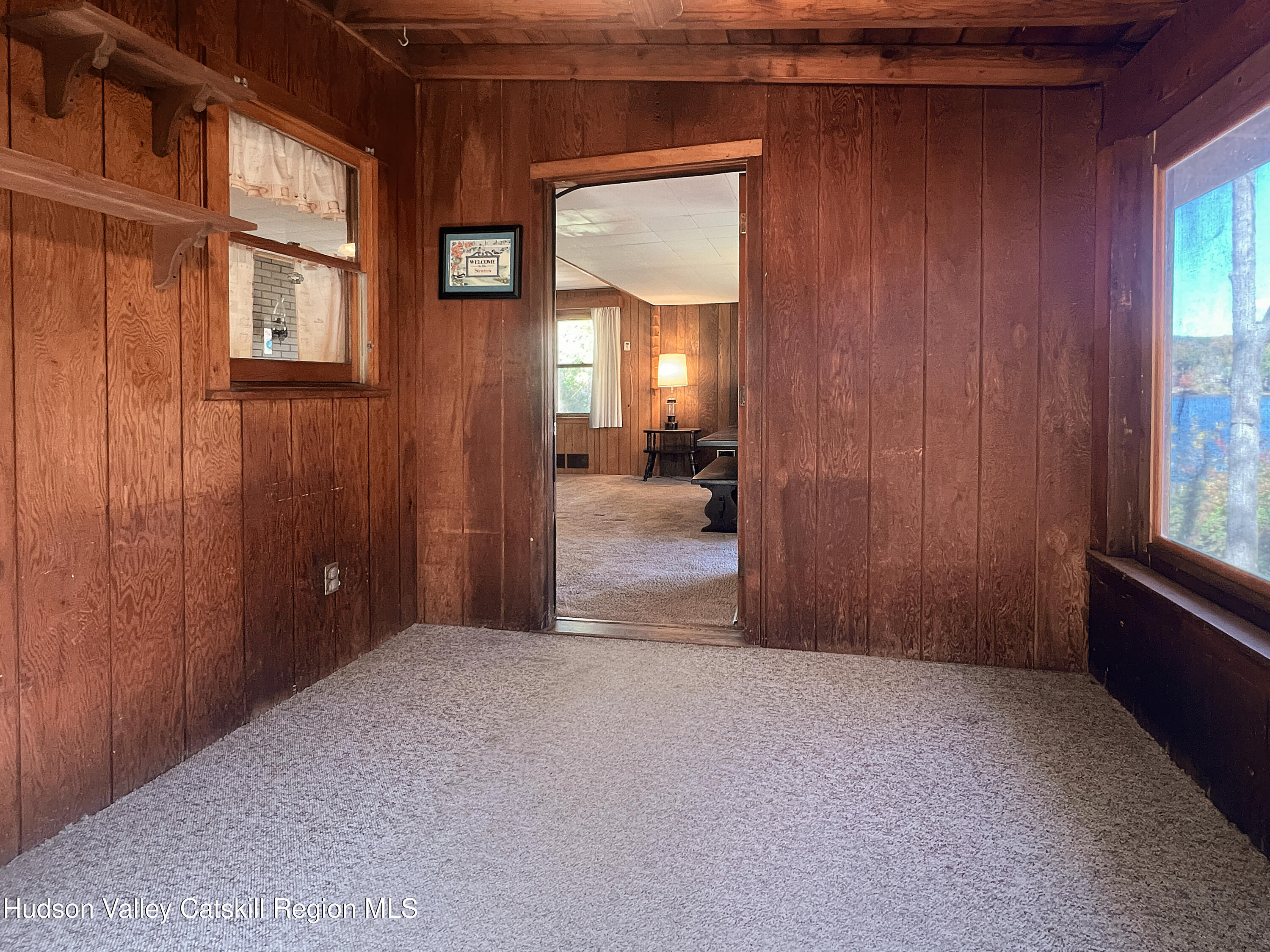 1076 Lakeview Road Copake, NY 12516 - Photo 2 of 19 a view of a livingroom with furniture and windows