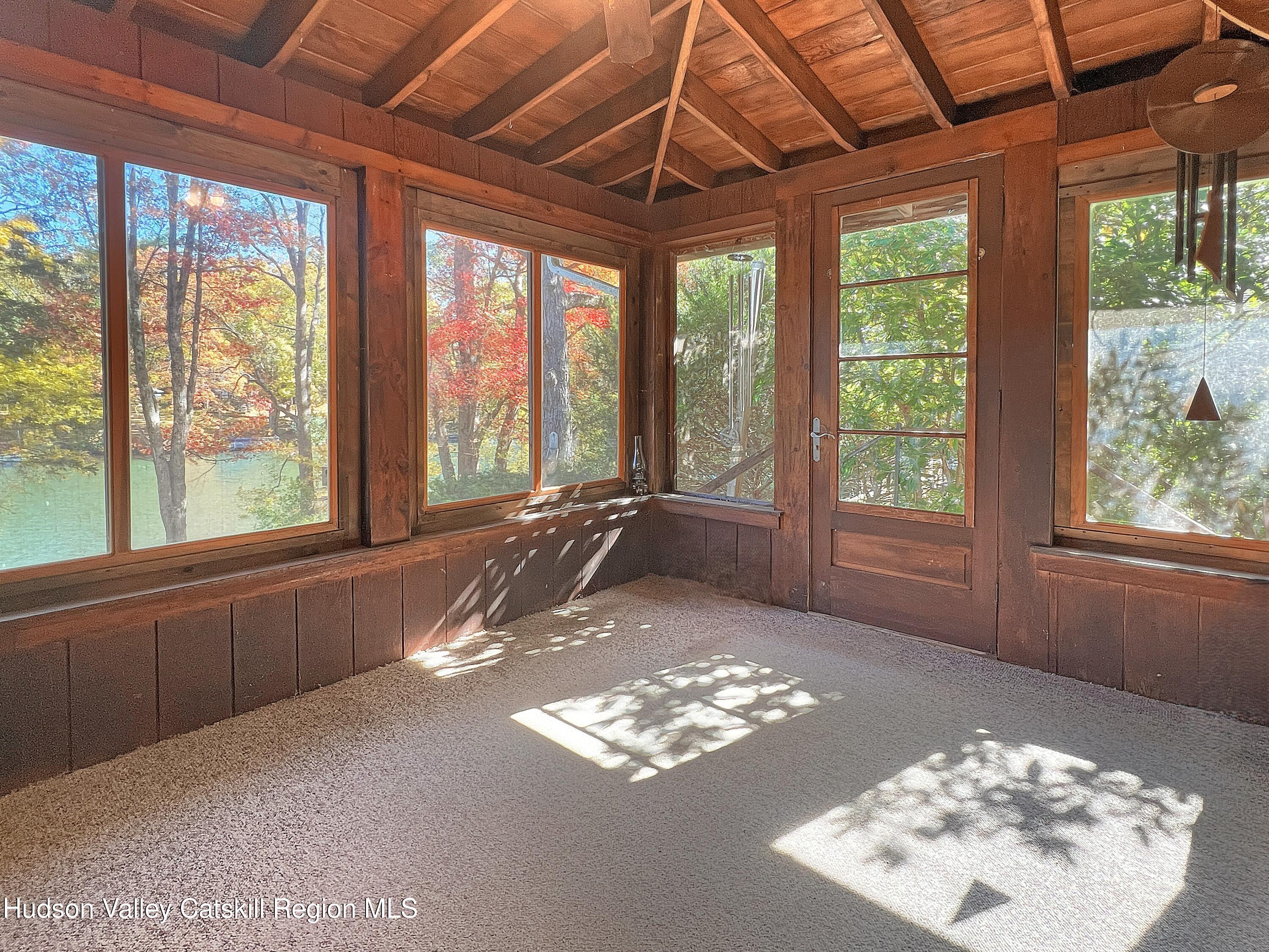 1076 Lakeview Road Copake, NY 12516 - Photo 3 of 19 a view of a room with a large window