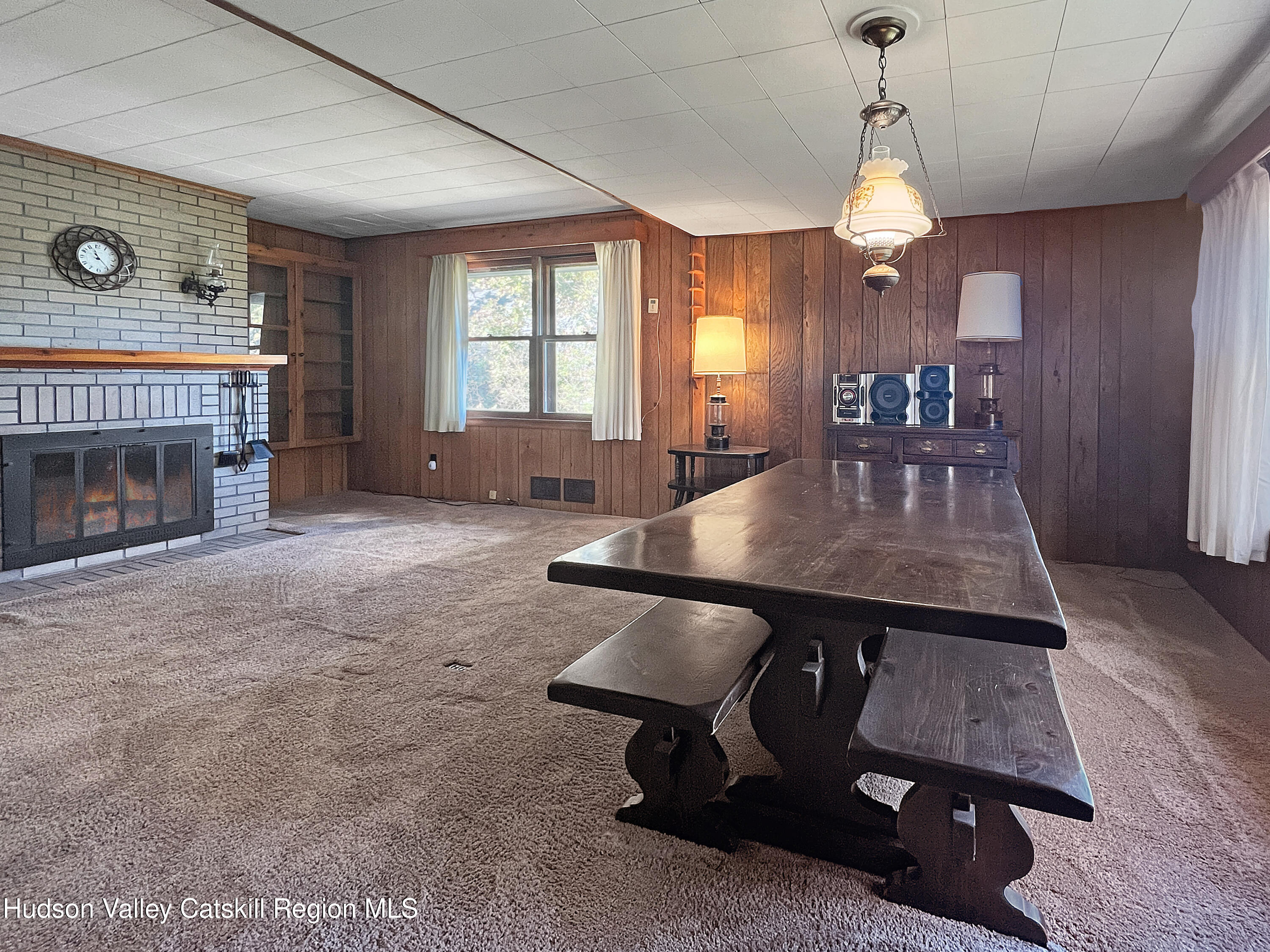 1076 Lakeview Road Copake, NY 12516 - Photo 4 of 19 an open kitchen with furniture and a fireplace