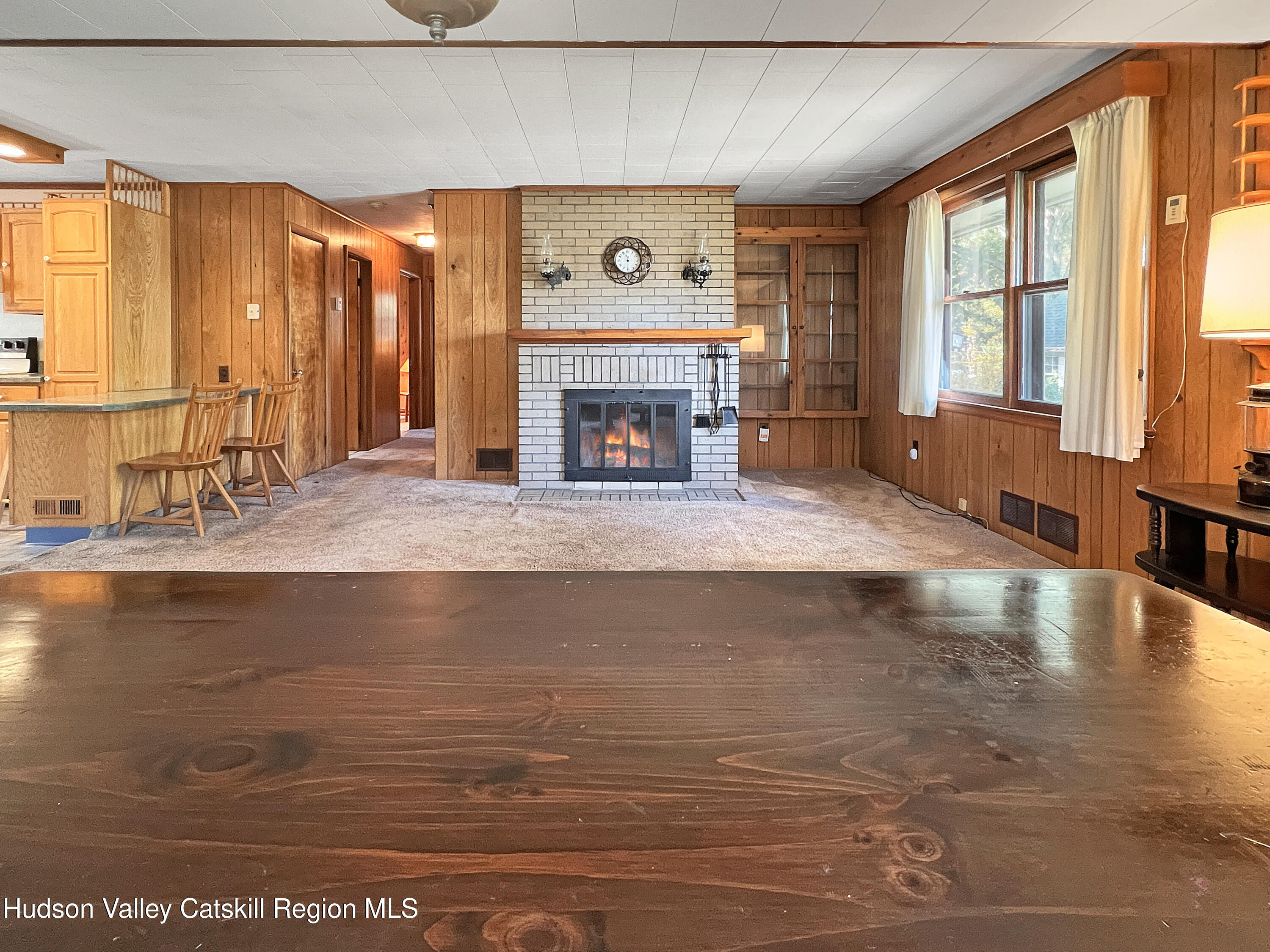 1076 Lakeview Road Copake, NY 12516 - Photo 7 of 19 a living room with fireplace furniture and a large window