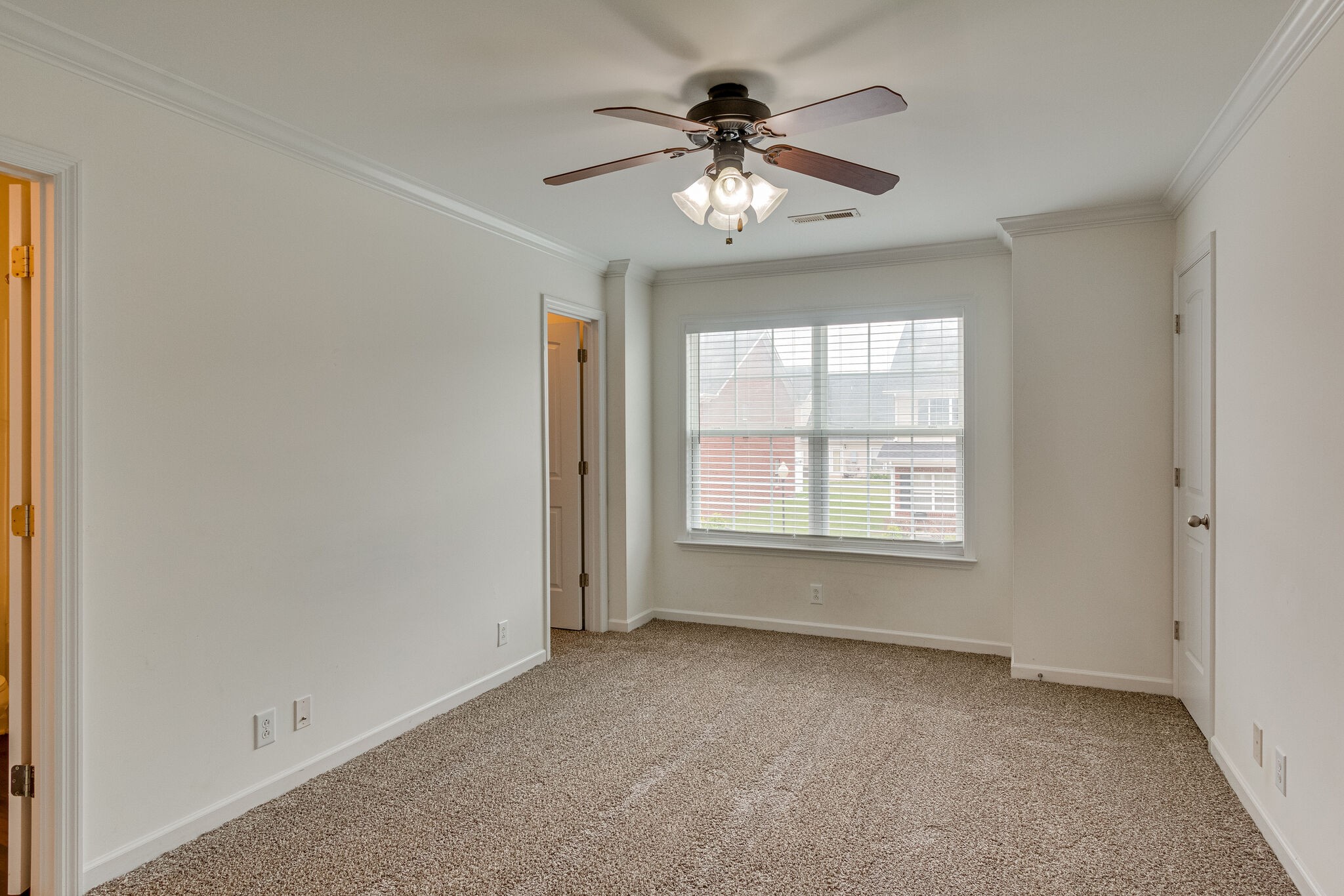 4251 Aurora Circle Murfreesboro, TN 37127 - Photo 8 of 11 an empty room with chandelier fan and windows