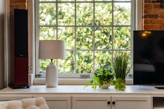 a bedroom with furniture and a window