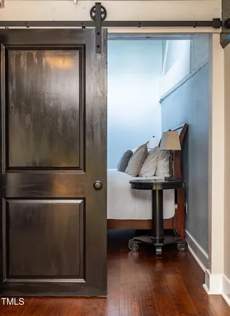 a view of a studio with wooden floor