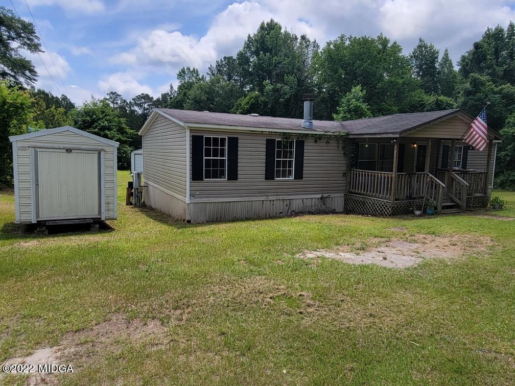 4460 Fulton Mill Road Macon, GA 31216 - Photo 2 of 23 a view of a house with a yard