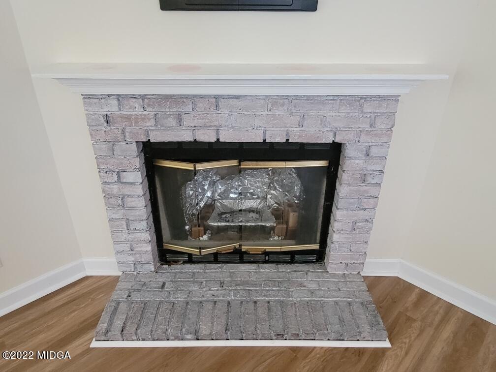 4460 Fulton Mill Road Macon, GA 31216 - Photo 4 of 23 a stone fireplace with a fireplace
