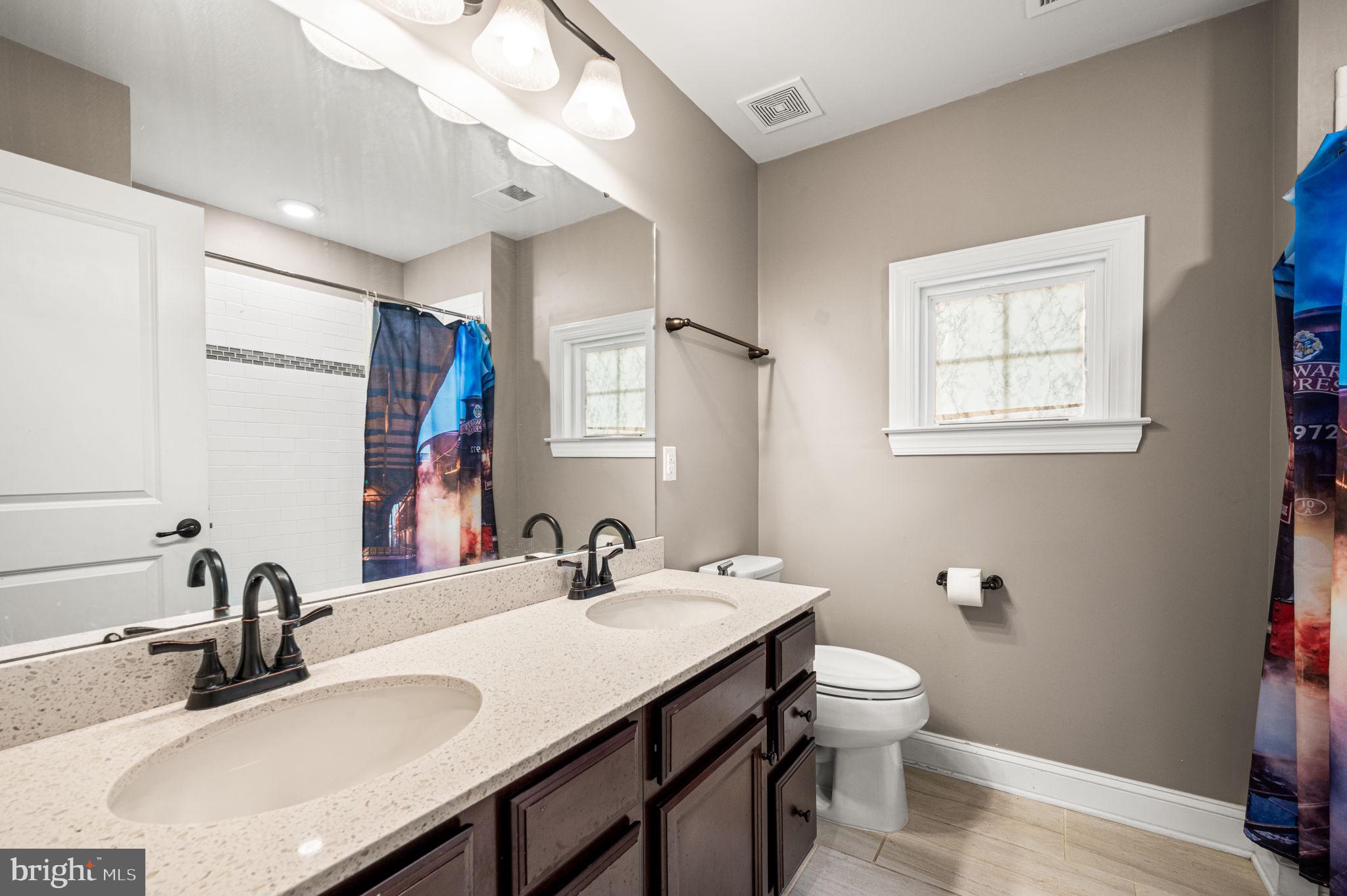 612 Quarry Point Road Malvern, PA 19355 - Photo 21 of 44 a bathroom with a sink and a toilet