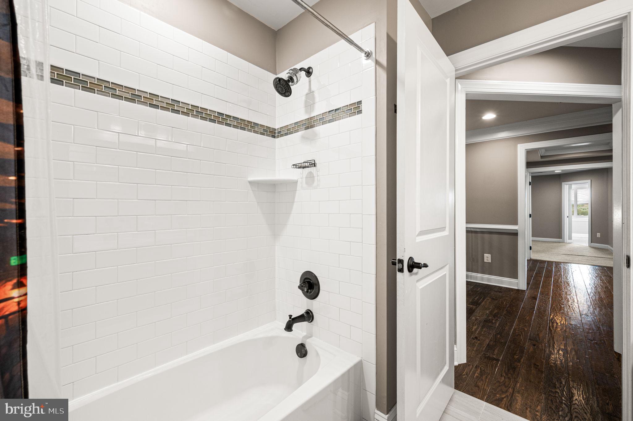 612 Quarry Point Road Malvern, PA 19355 - Photo 22 of 44 a bathroom with a bathtub and a shower
