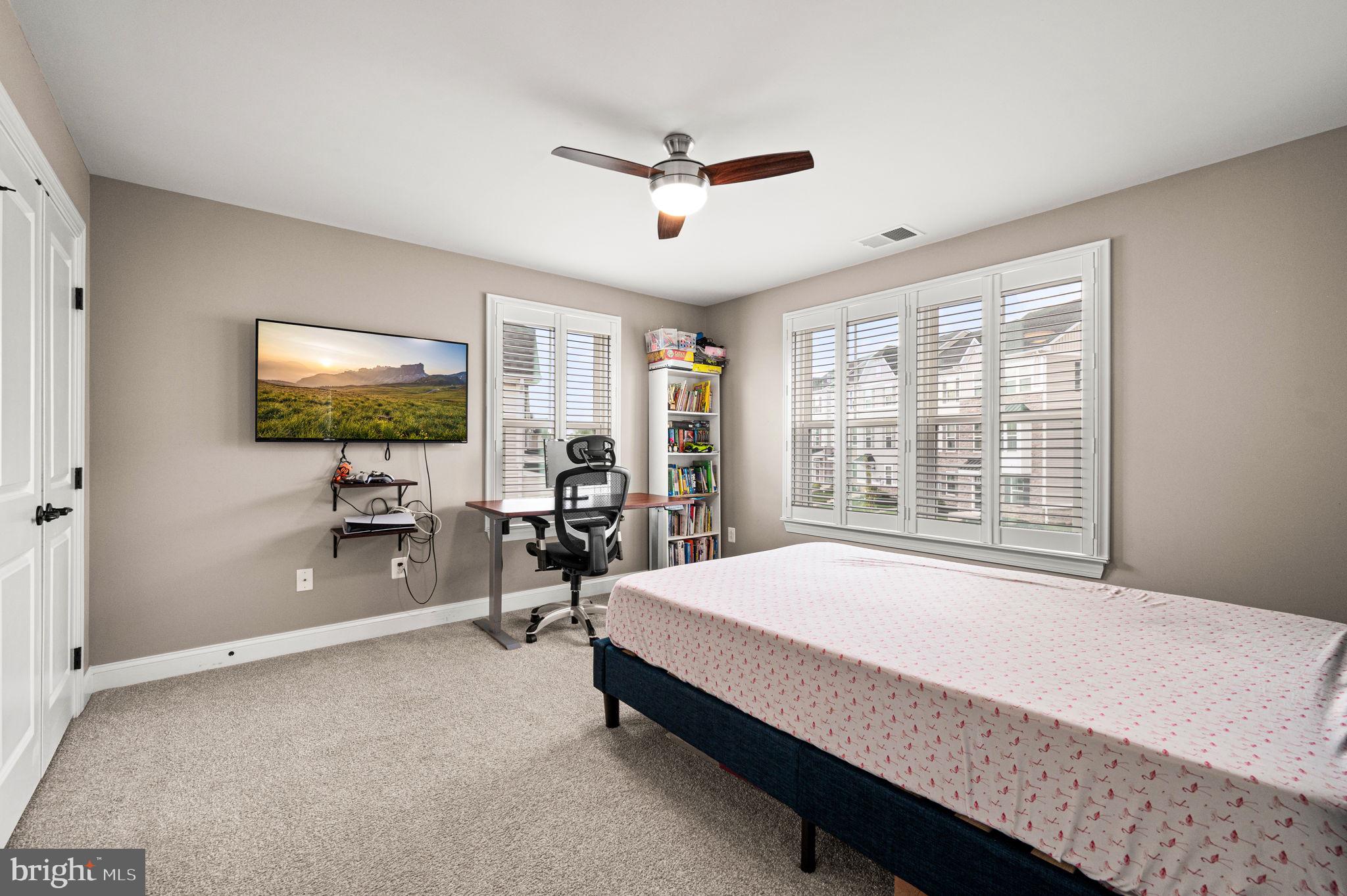 612 Quarry Point Road Malvern, PA 19355 - Photo 23 of 44 a spacious bedroom with a bed and large mirror