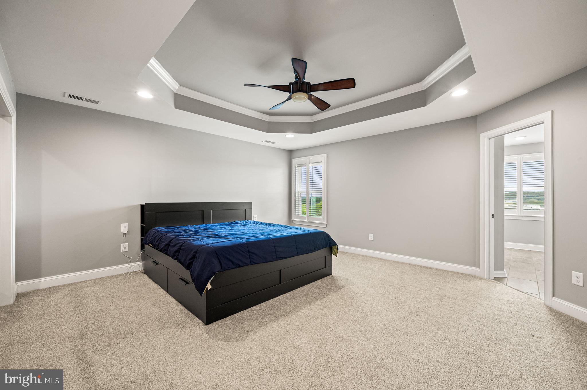 612 Quarry Point Road Malvern, PA 19355 - Photo 26 of 44 a spacious bedroom with a bed and ceiling fan