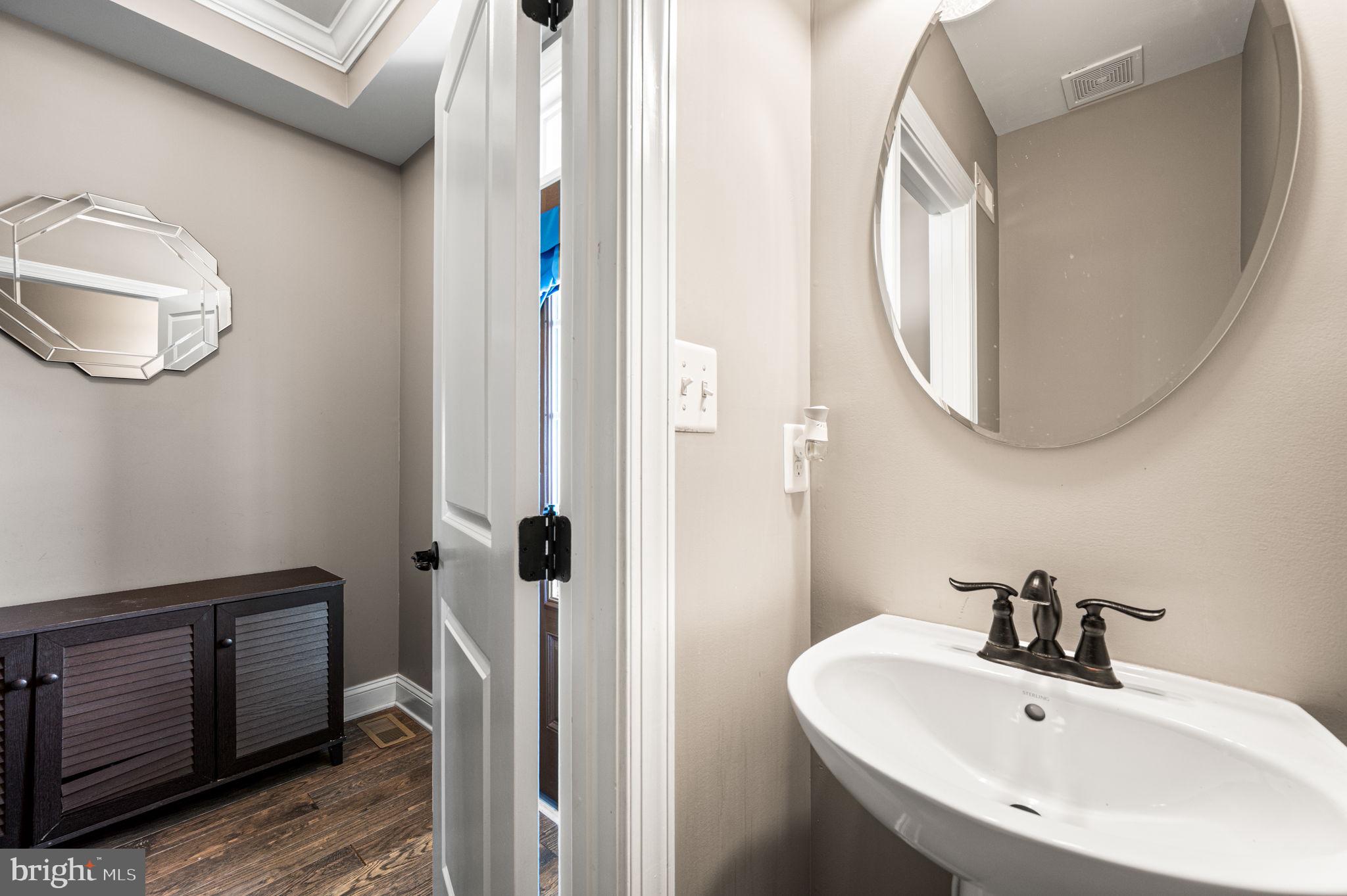 612 Quarry Point Road Malvern, PA 19355 - Photo 33 of 44 a bathroom with a sink and a mirror