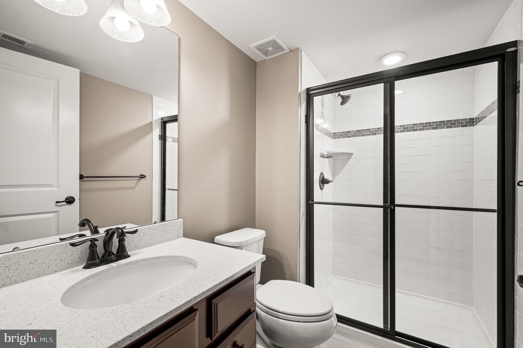 612 Quarry Point Road Malvern, PA 19355 - Photo 34 of 44 a bathroom with a sink toilet a mirror and shower