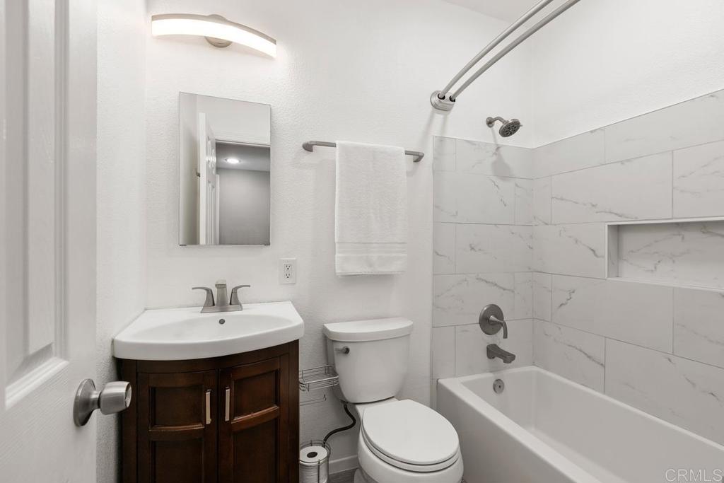 1451 Gowin Street Spring Valley, CA 91977 - Photo 11 of 24 a bathroom with a sink a toilet and shower