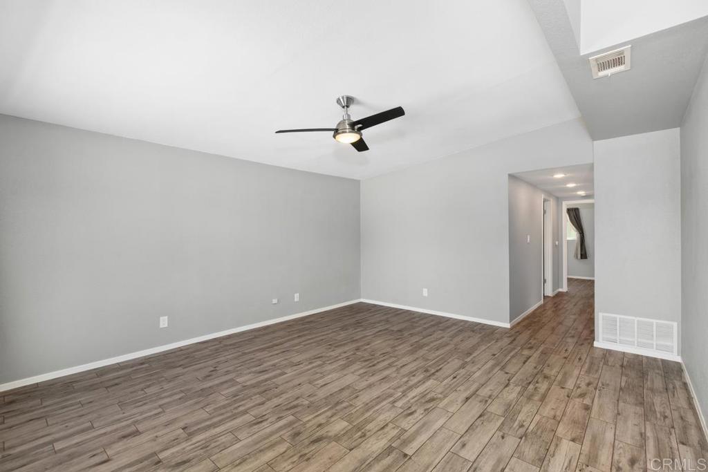 1451 Gowin Street Spring Valley, CA 91977 - Photo 3 of 24 wooden floor in an empty room with a window