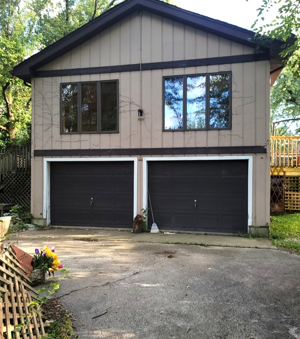 2166 Maple Road Homewood, IL 60430 - Photo 2 of 13 a front view of a house with a garage