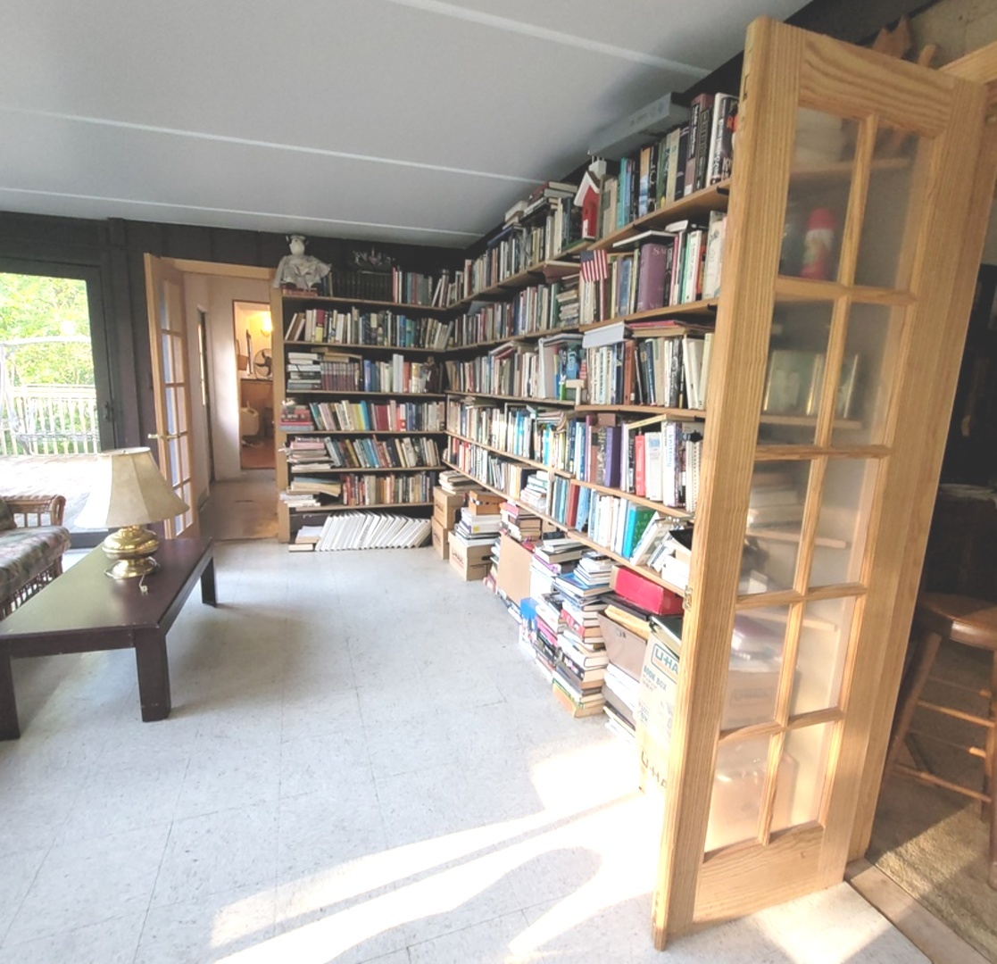 2166 Maple Road Homewood, IL 60430 - Photo 5 of 13 a living room with furniture and a book shelf