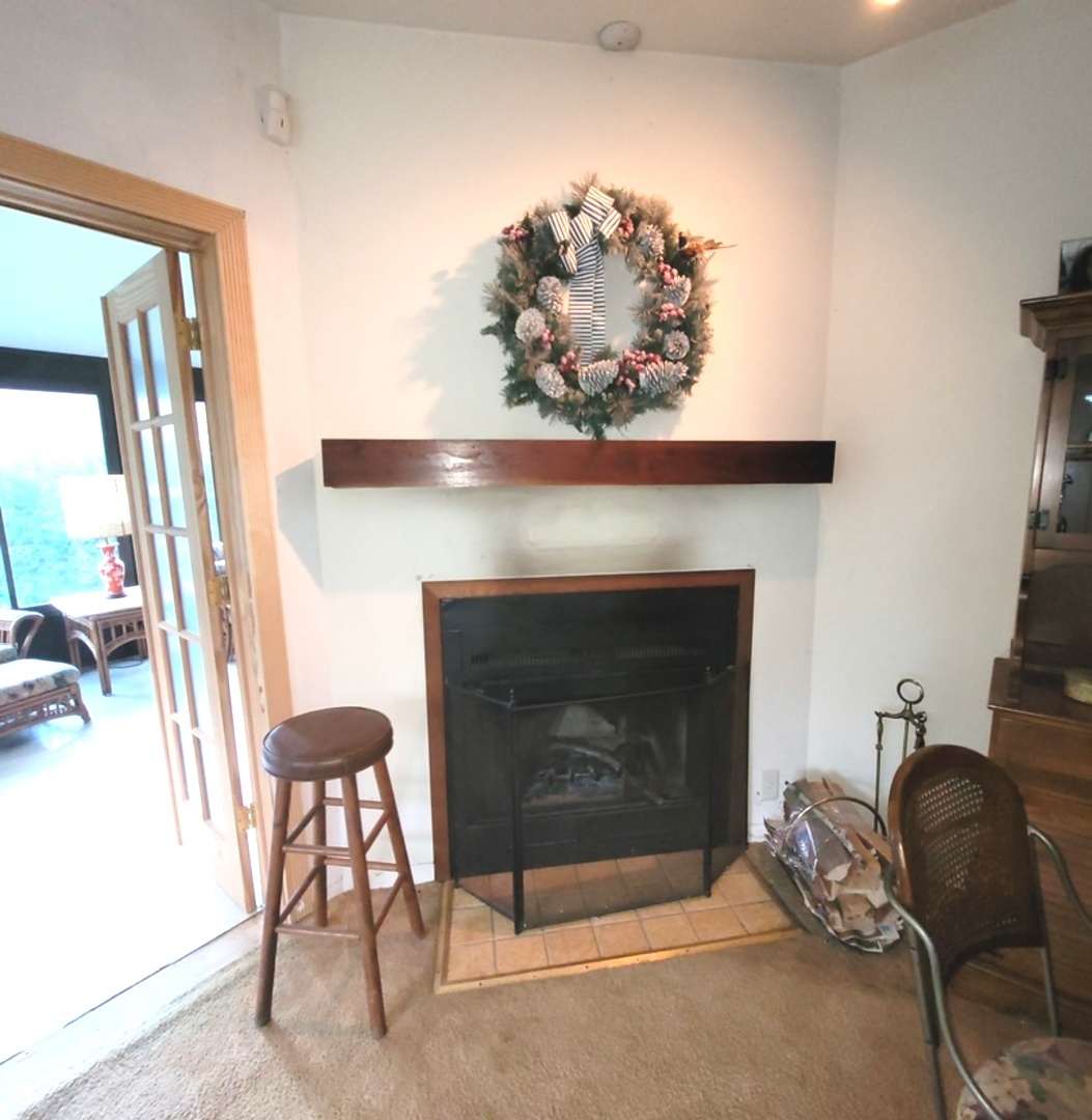 2166 Maple Road Homewood, IL 60430 - Photo 6 of 13 a living room with furniture and a fireplace