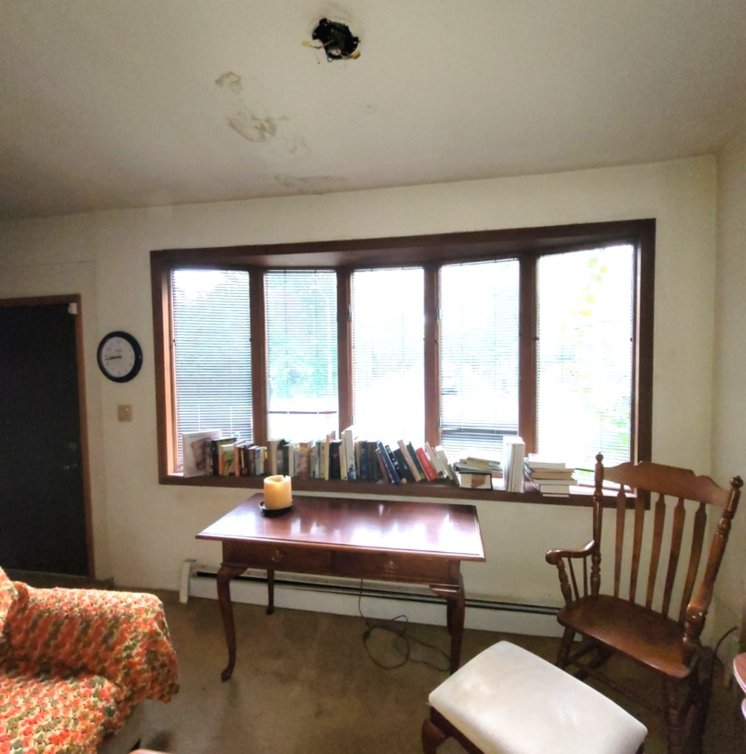 2166 Maple Road Homewood, IL 60430 - Photo 7 of 13 a living room with furniture and a large window