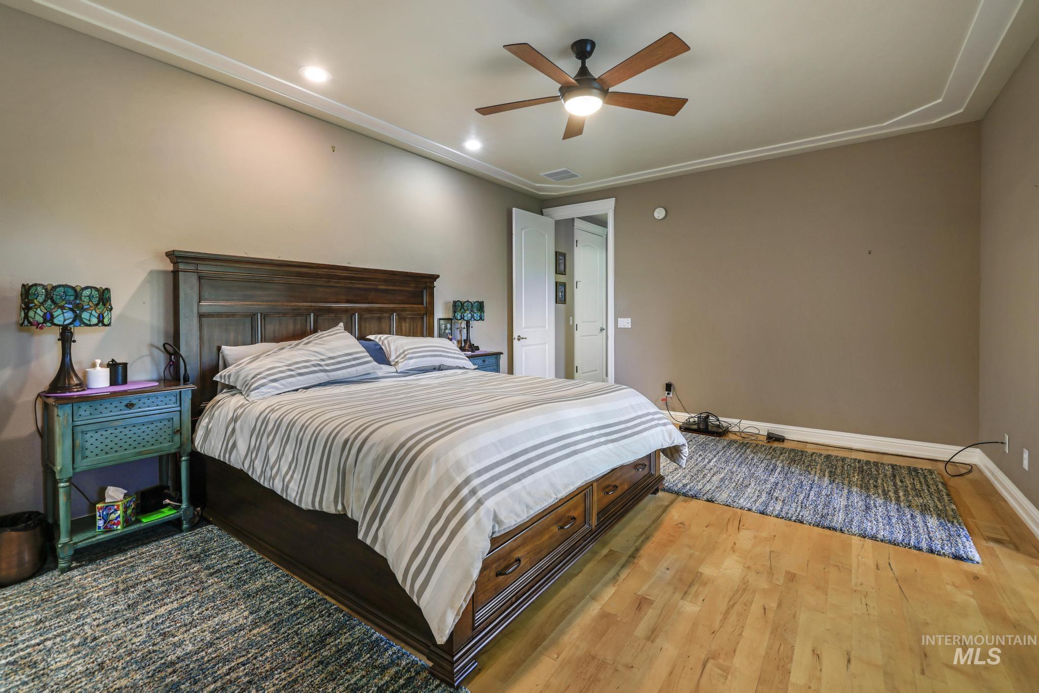 100 Olympic Road Jerome, ID 83338 - Photo 18 of 50 Spacious room featuring light wood-finish flooring, recessed lighting, a ceiling fan, and crown molding