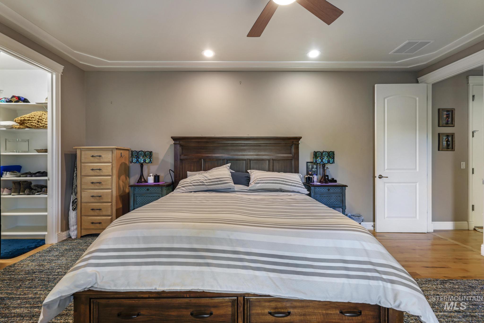 100 Olympic Road Jerome, ID 83338 - Photo 19 of 50 Bedroom featuring crown molding, recessed lighting, a ceiling fan, and wood-finish flooring