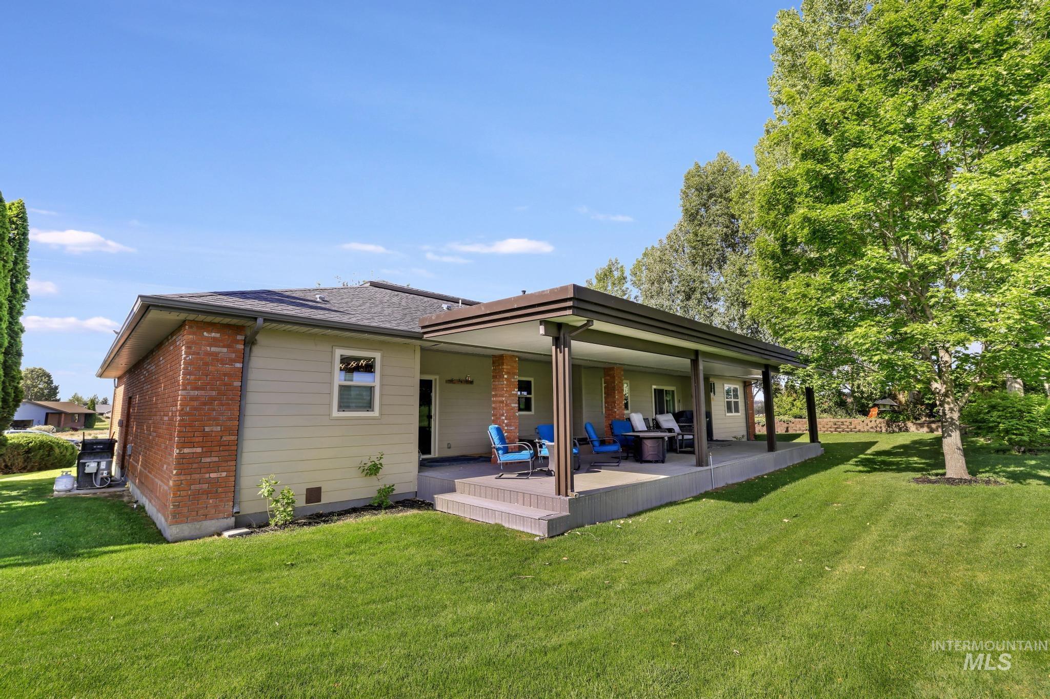 100 Olympic Road Jerome, ID 83338 - Photo 7 of 50 Expansive covered patio with recessed lighting, brick columns, and a concrete surface