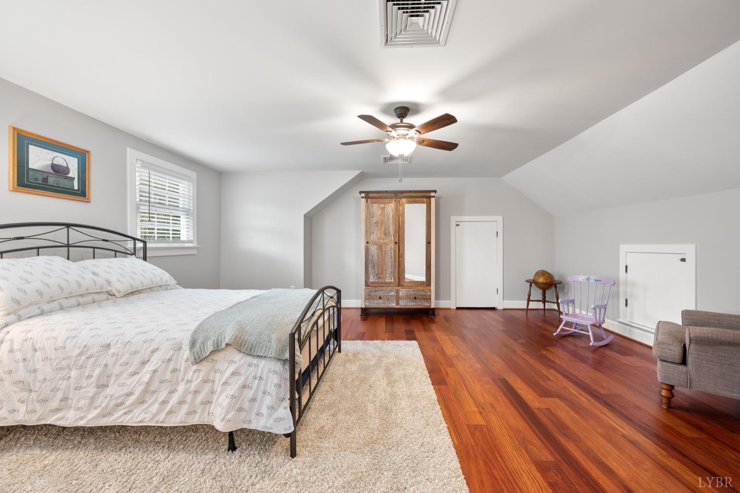 3250 White Road Forest, VA 24551 - Photo 35 of 67 a bedroom with a bed and a chandelier