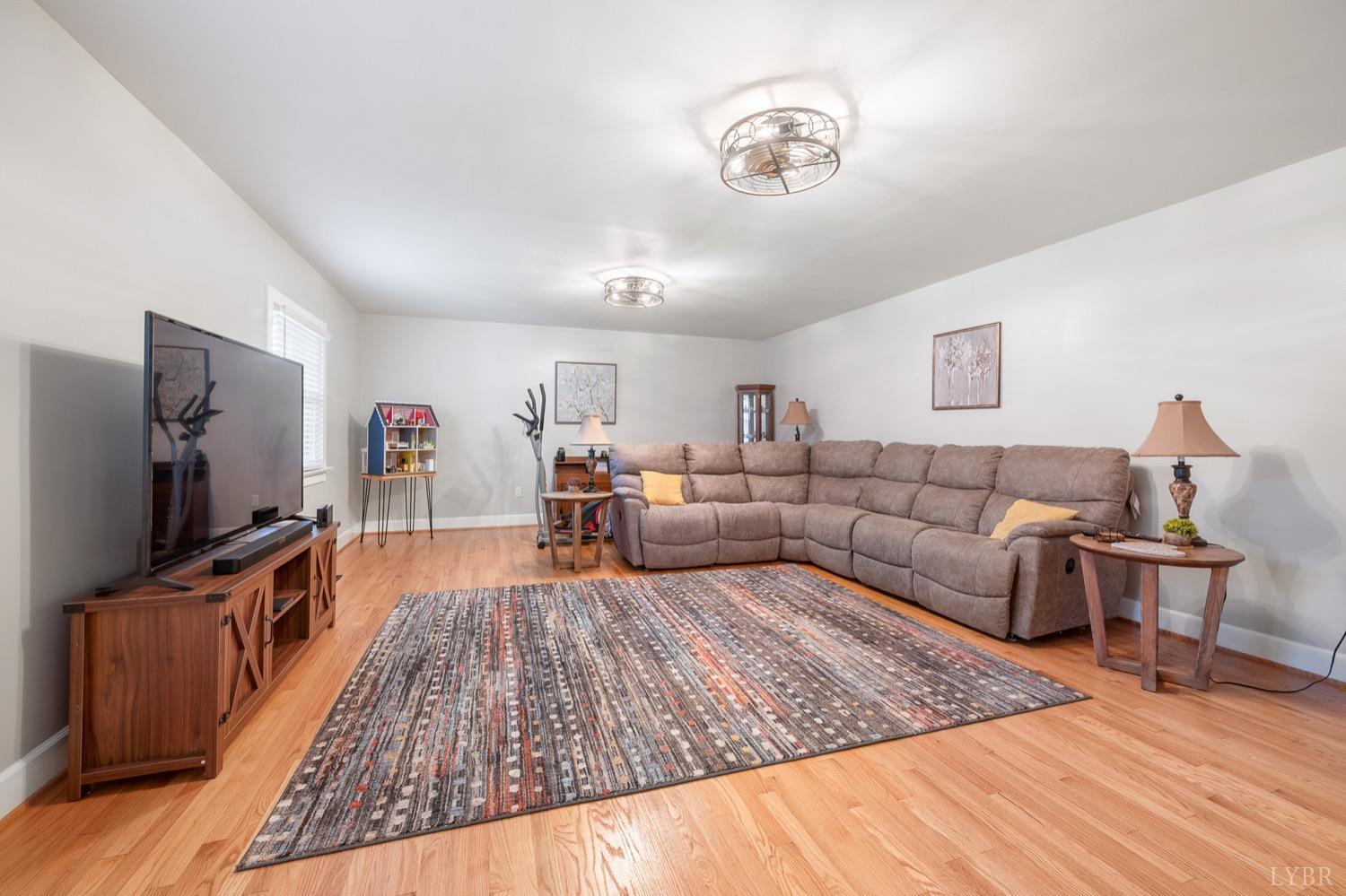 3250 White Road Forest, VA 24551 - Photo 10 of 67 a living room with furniture and a flat screen tv