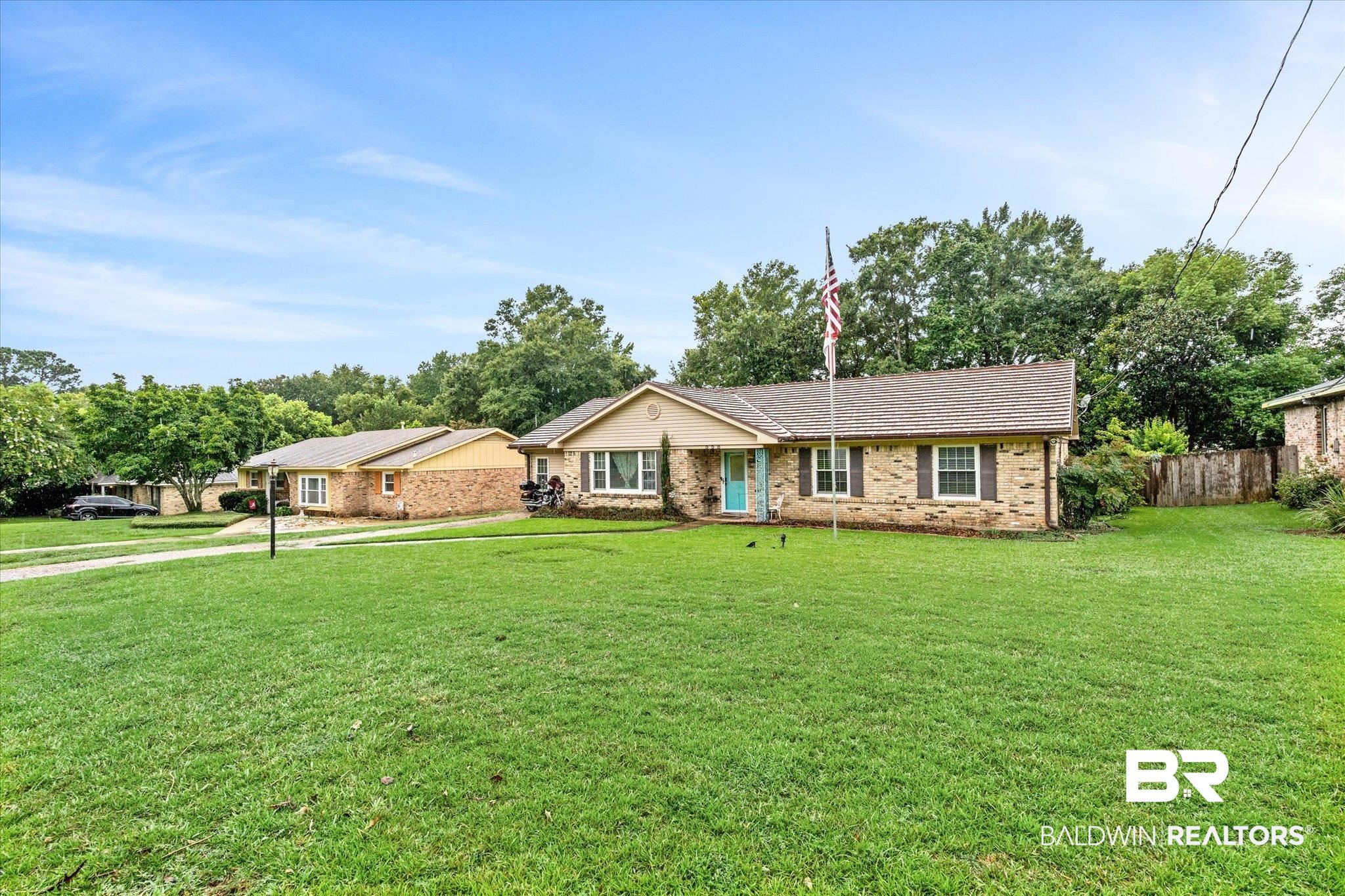558 Stuart Street Daphne, AL 36526 - Photo 23 of 29 Ranch-style house featuring a front lawn