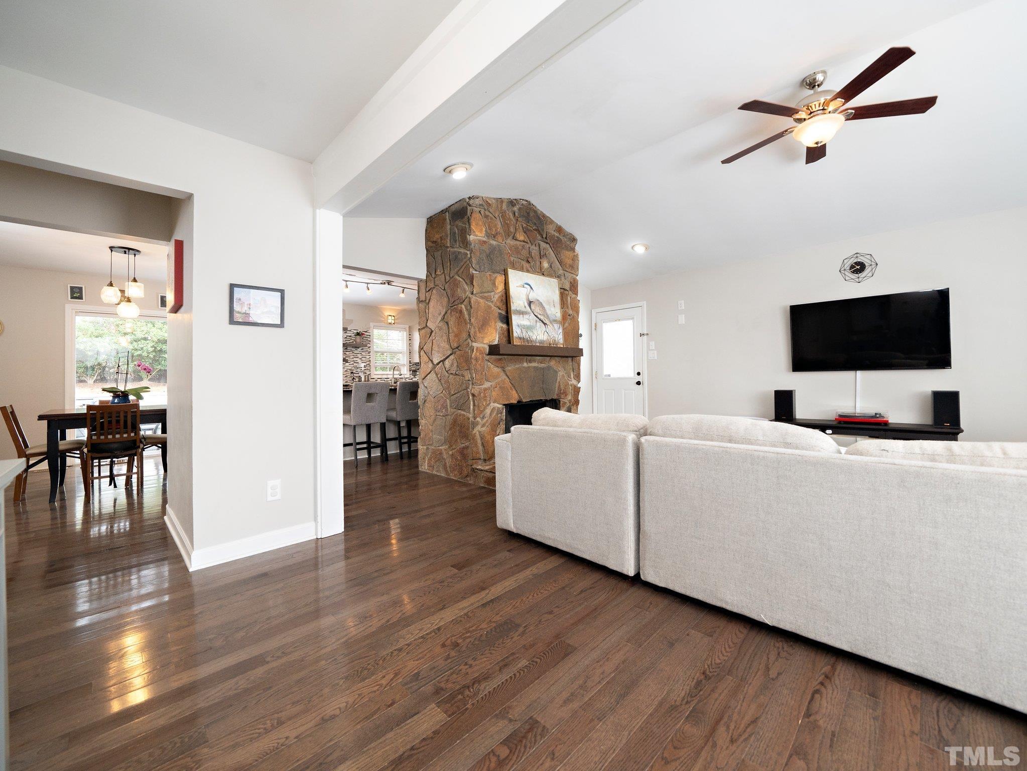 5433 Old Towne Road Raleigh, NC 27612 - Photo 10 of 32 a living room with furniture and a flat screen tv