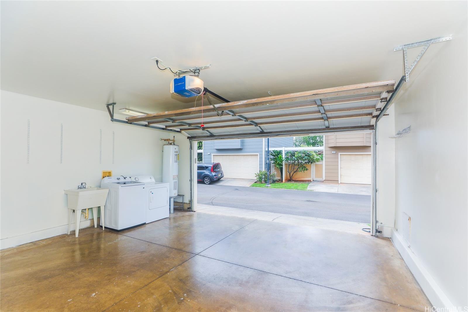 91-1011 Laulauna Street, Unit 136 Ewa Beach, HI 96706 - Photo 23 of 25 a very nice looking room with a chair