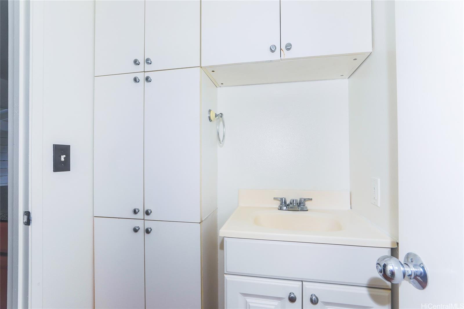 91-1011 Laulauna Street, Unit 136 Ewa Beach, HI 96706 - Photo 8 of 25 a bathroom with a shower and a sink