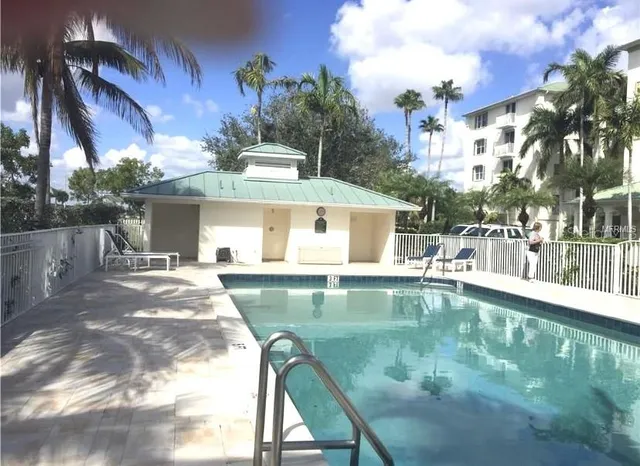 a view of a swimming pool with a patio