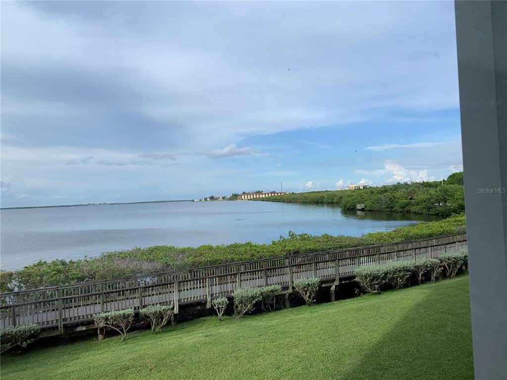 200 Harbor Walk Drive, Unit 321 Punta Gorda, FL 33950 - Photo 23 of 29 a view of a green field with an ocean