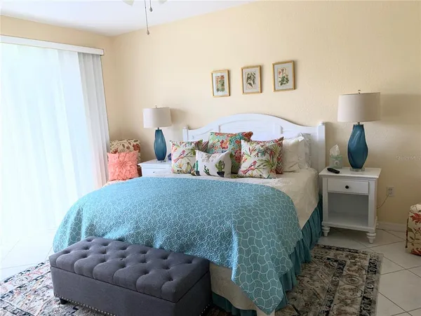 a bedroom with a bed and a couch