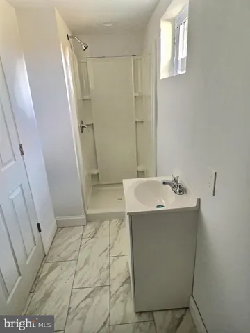 a view of bathroom with bathtub and sink