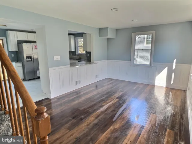 a view of a living room and wooden floor