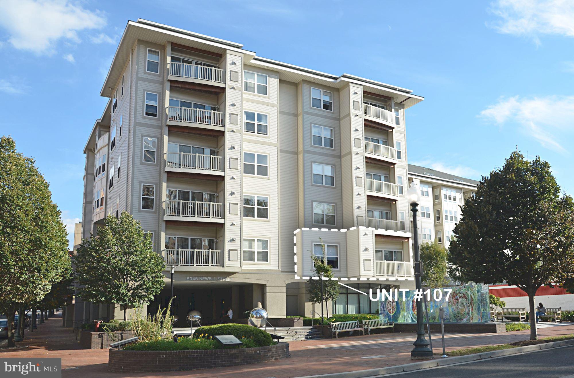 8045 Newell Street, Unit 107 Silver Spring, MD 20910 - Photo 44 of 75 a front view of a building with street view