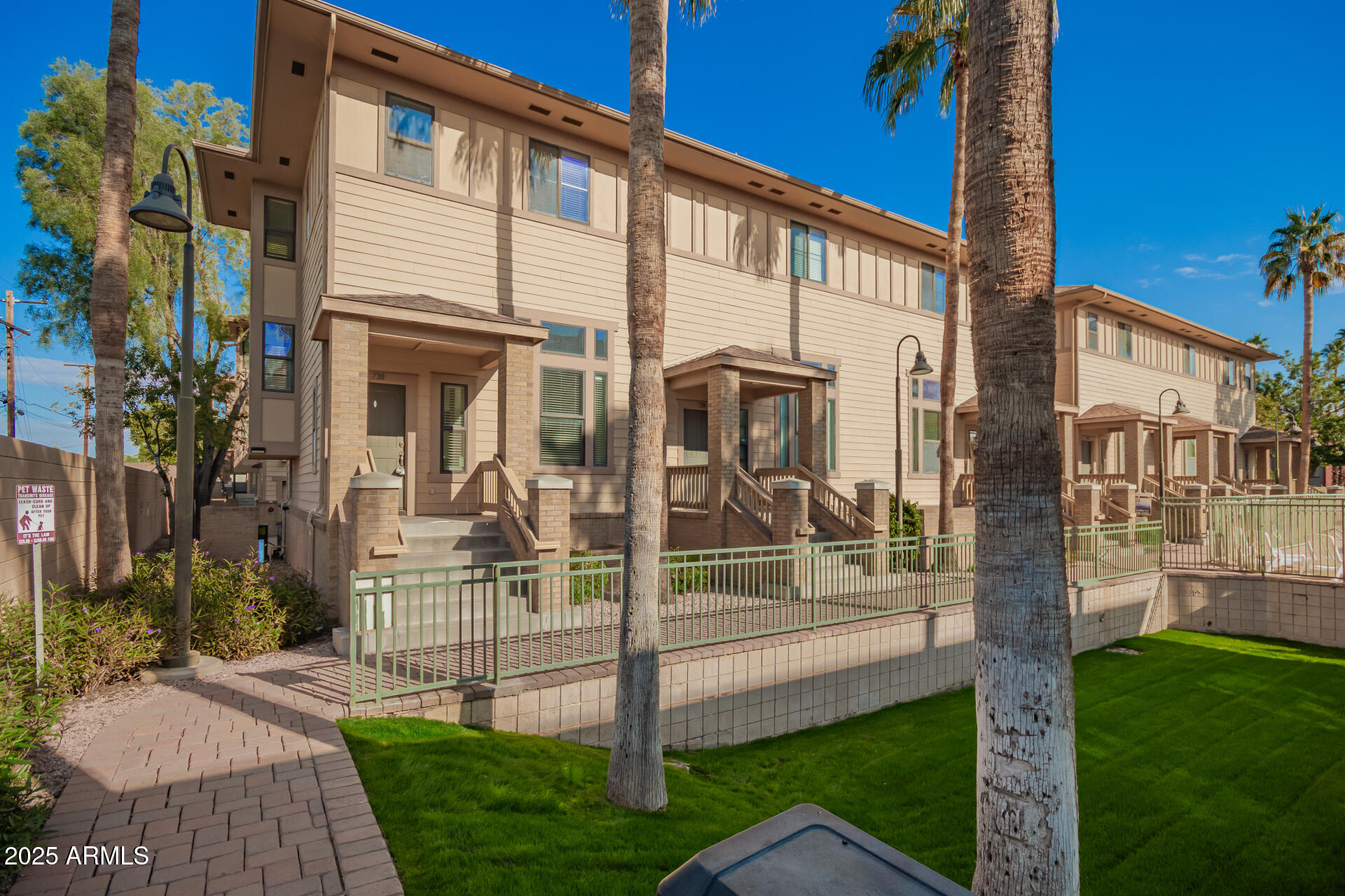 738 South Beck Avenue Tempe, AZ 85281 - Photo 1 of 31 a view of a house with many windows next to a yard